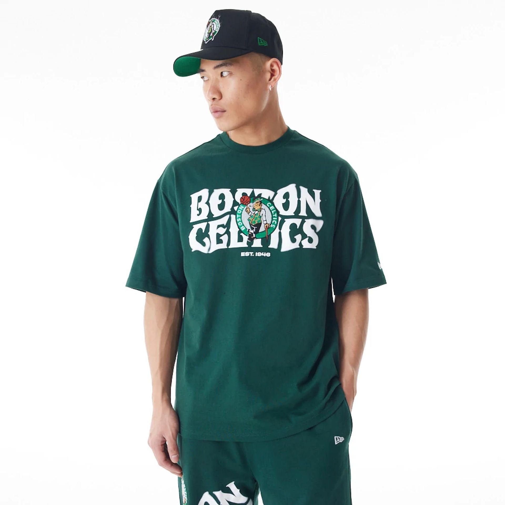 The Male model is wearing Boston Celtics NBA Graphic Dark Green Oversized T-Shirt  1