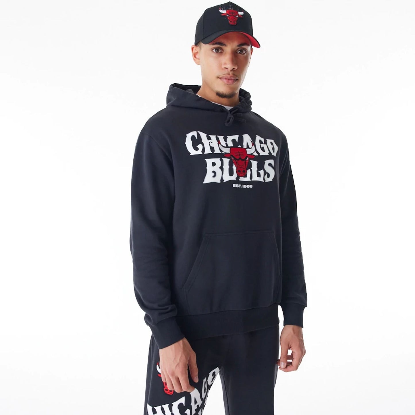 The Male model is wearing Chicago Bulls NBA Graphic Black Oversized Pullover Hoodie  2