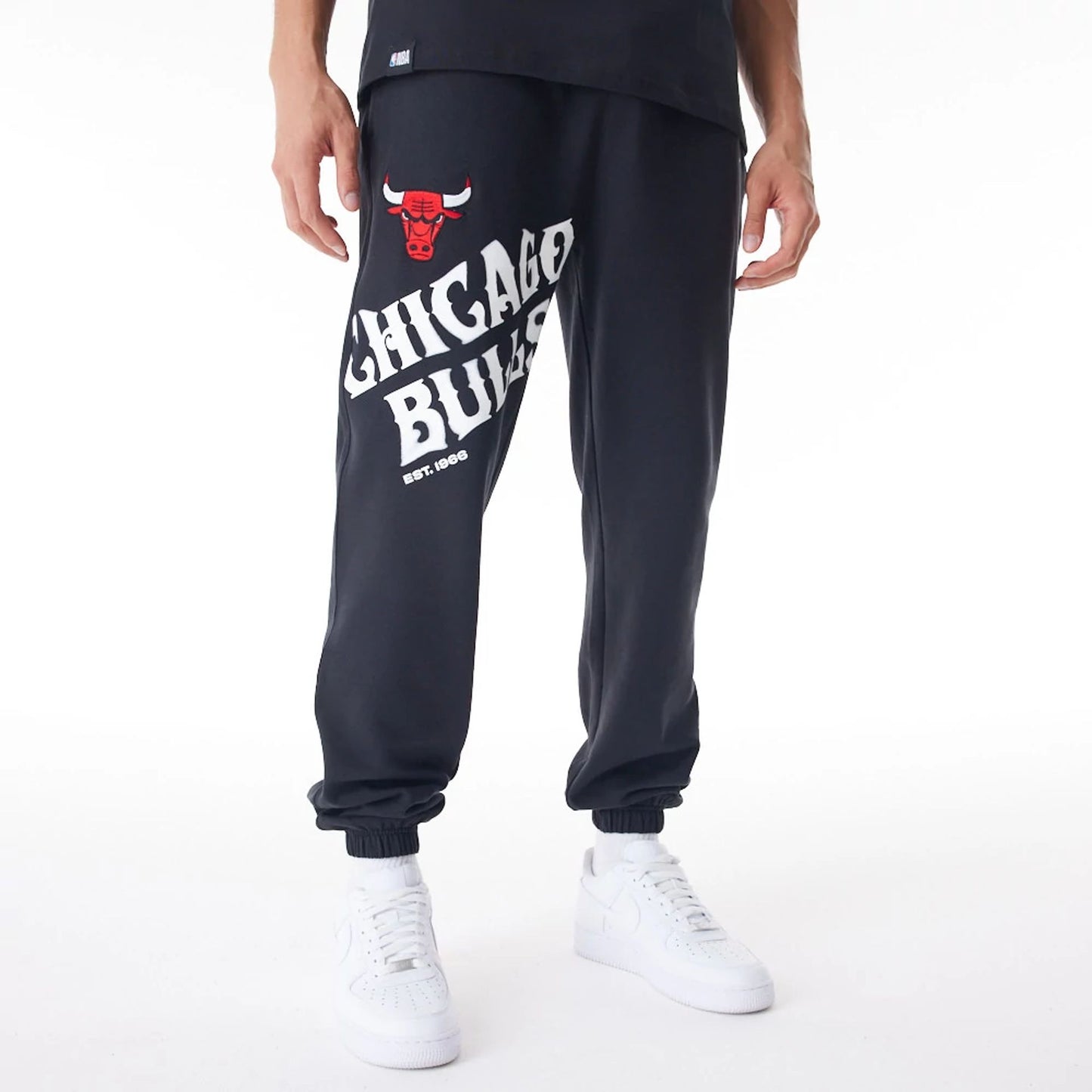 The Male model is wearing Chicago Bulls NBA Graphic Black Joggers  1