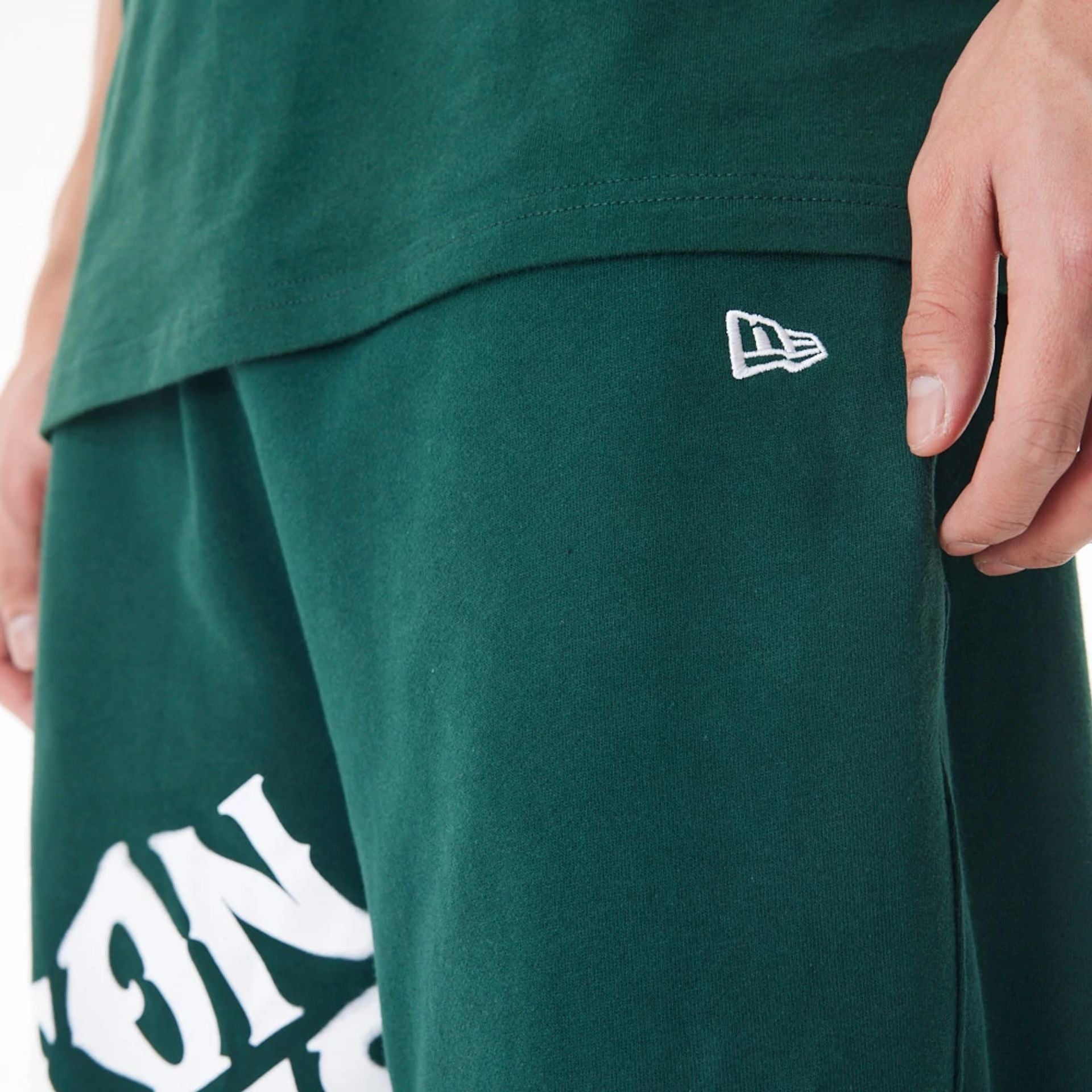 The Male model is wearing Boston Celtics NBA Graphic Dark Green Joggers  7