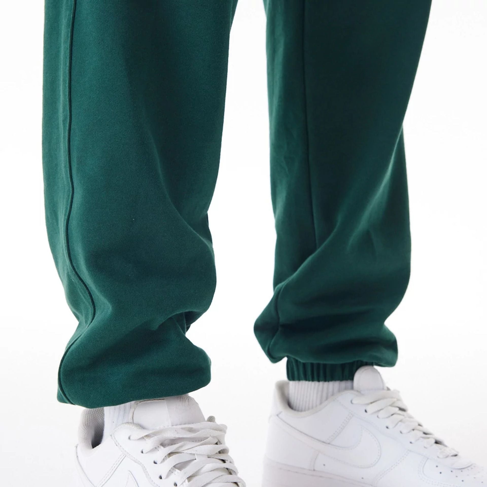 The Male model is wearing Boston Celtics NBA Graphic Dark Green Joggers  8