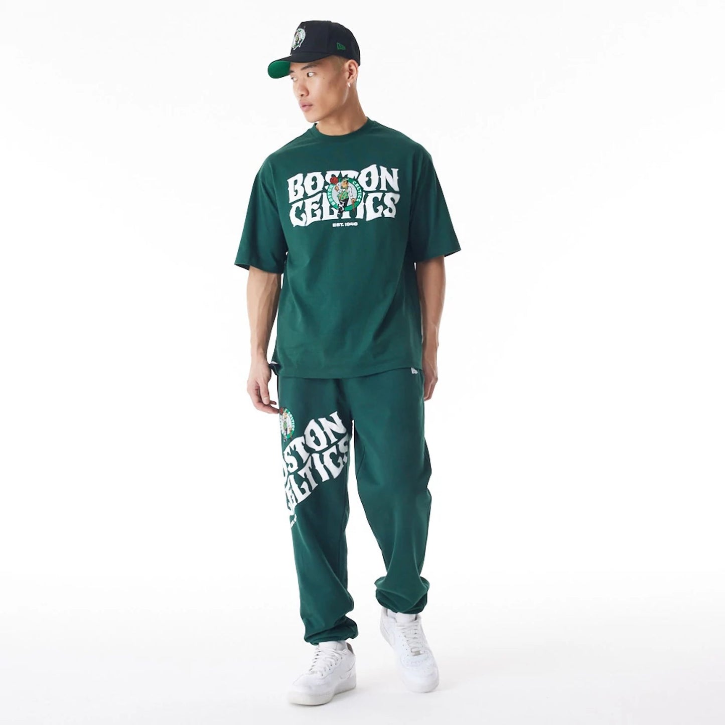 The Male model is wearing Boston Celtics NBA Graphic Dark Green Joggers  3