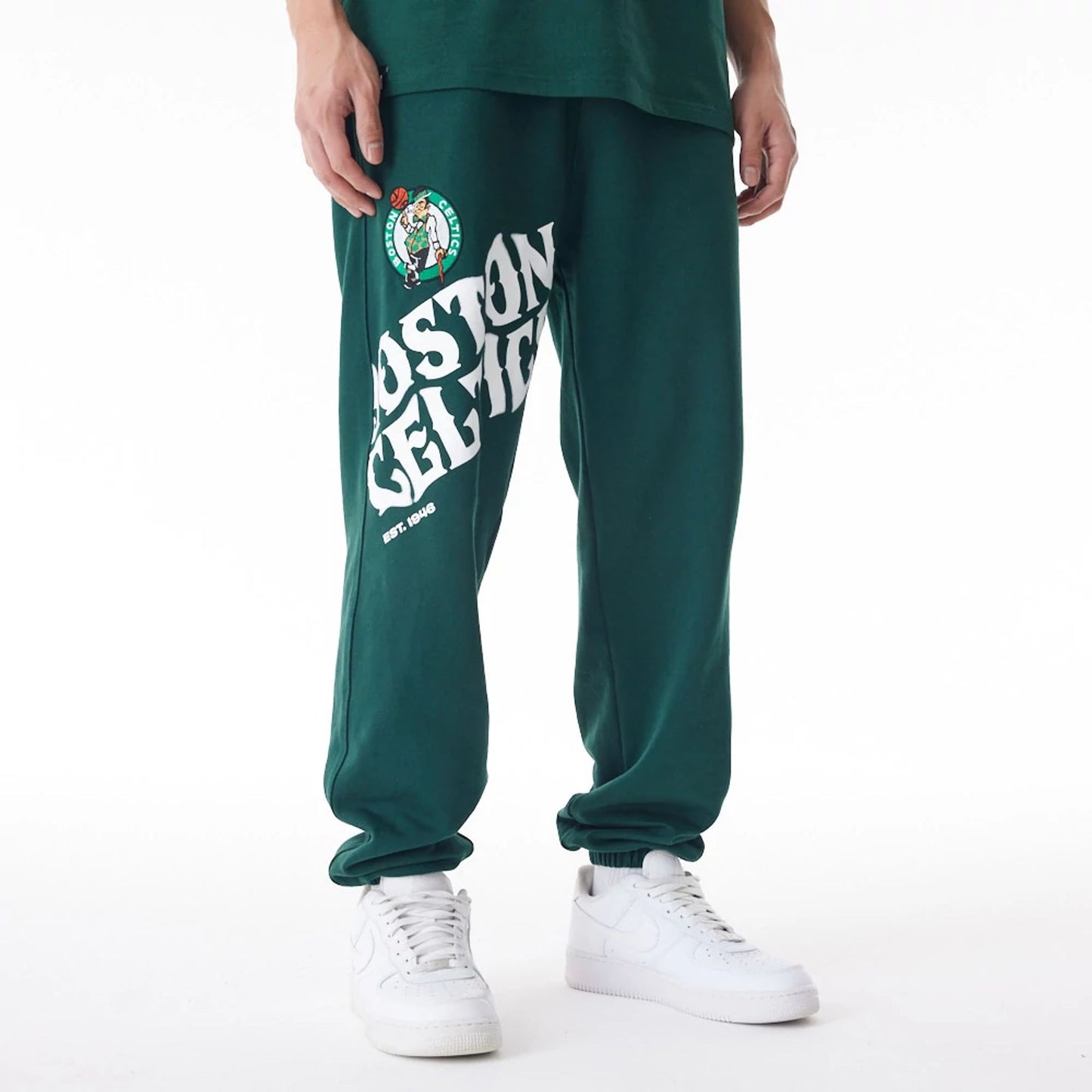 The Male model is wearing Boston Celtics NBA Graphic Dark Green Joggers  1