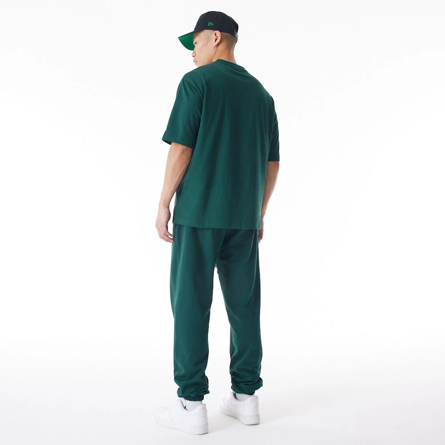 The Male model is wearing Boston Celtics NBA Graphic Dark Green Joggers  4