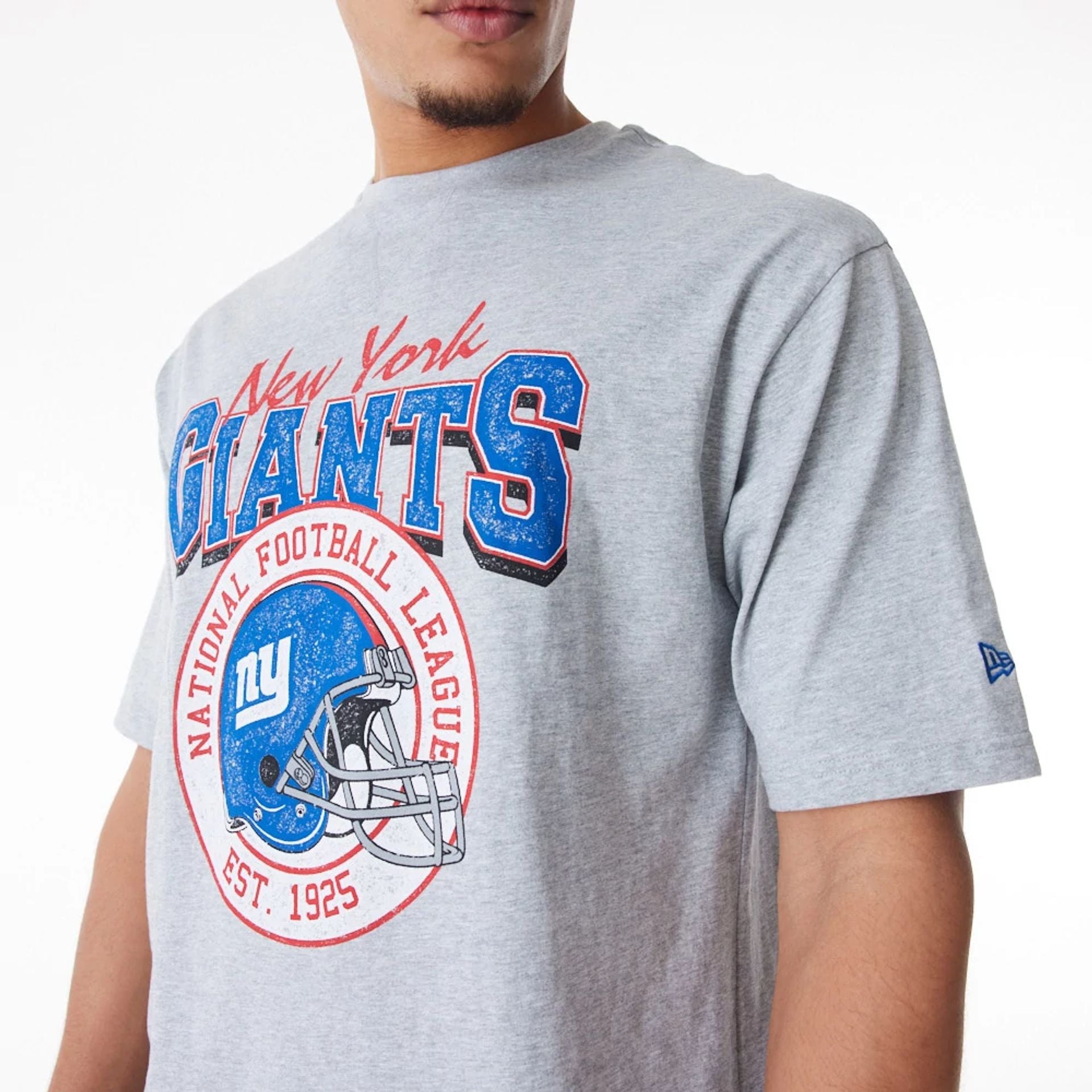 The Male model is wearing New York Giants NFL Helmet Graphic Grey Oversized T-Shirt  3