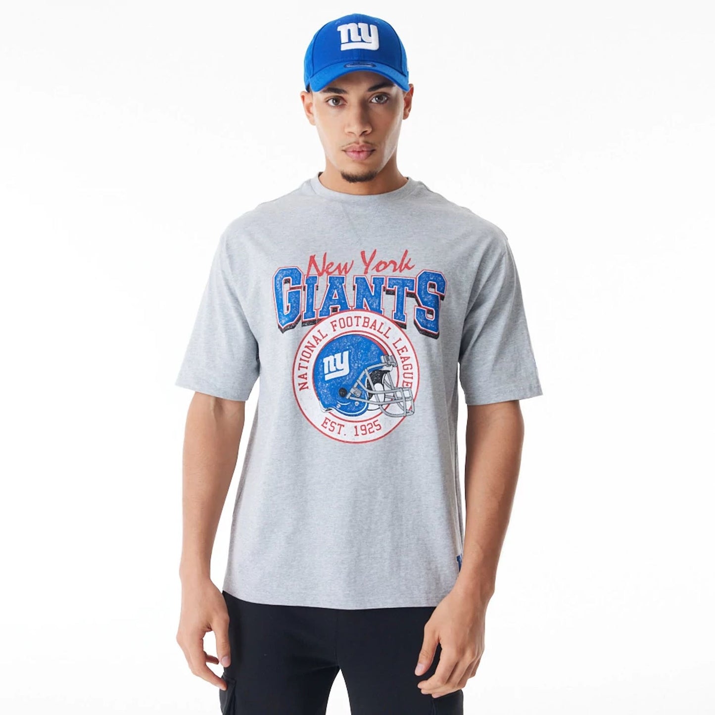 The Male model is wearing New York Giants NFL Helmet Graphic Grey Oversized T-Shirt  1