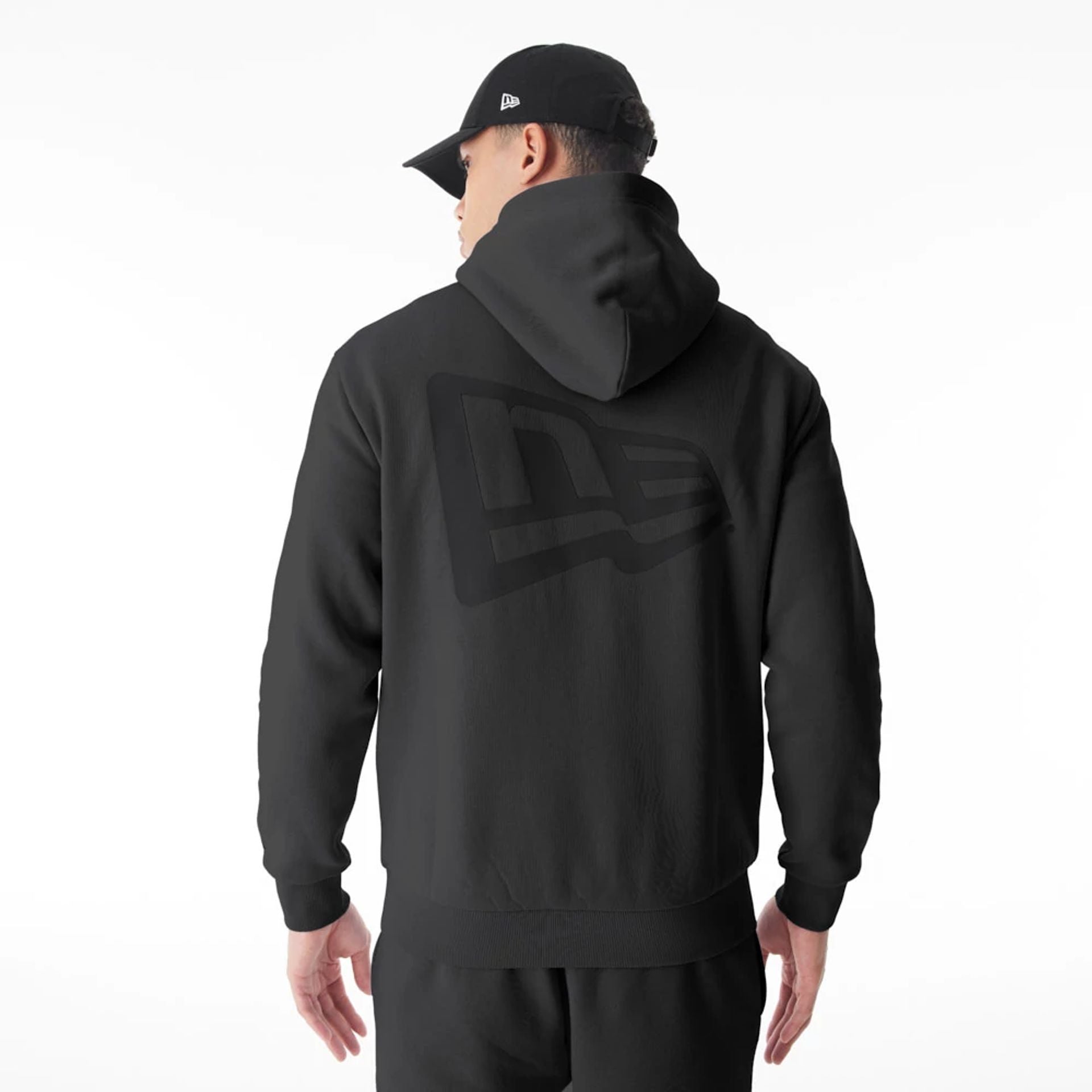 The Male model is wearing  New Era Flag Black Oversized Pullover Hoodie  6