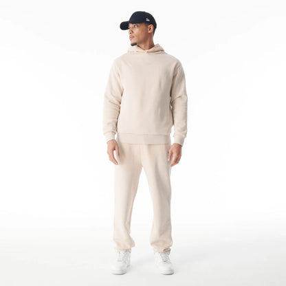 The Male model is wearing  New Era Flag Cream Oversized Pullover Hoodie  8