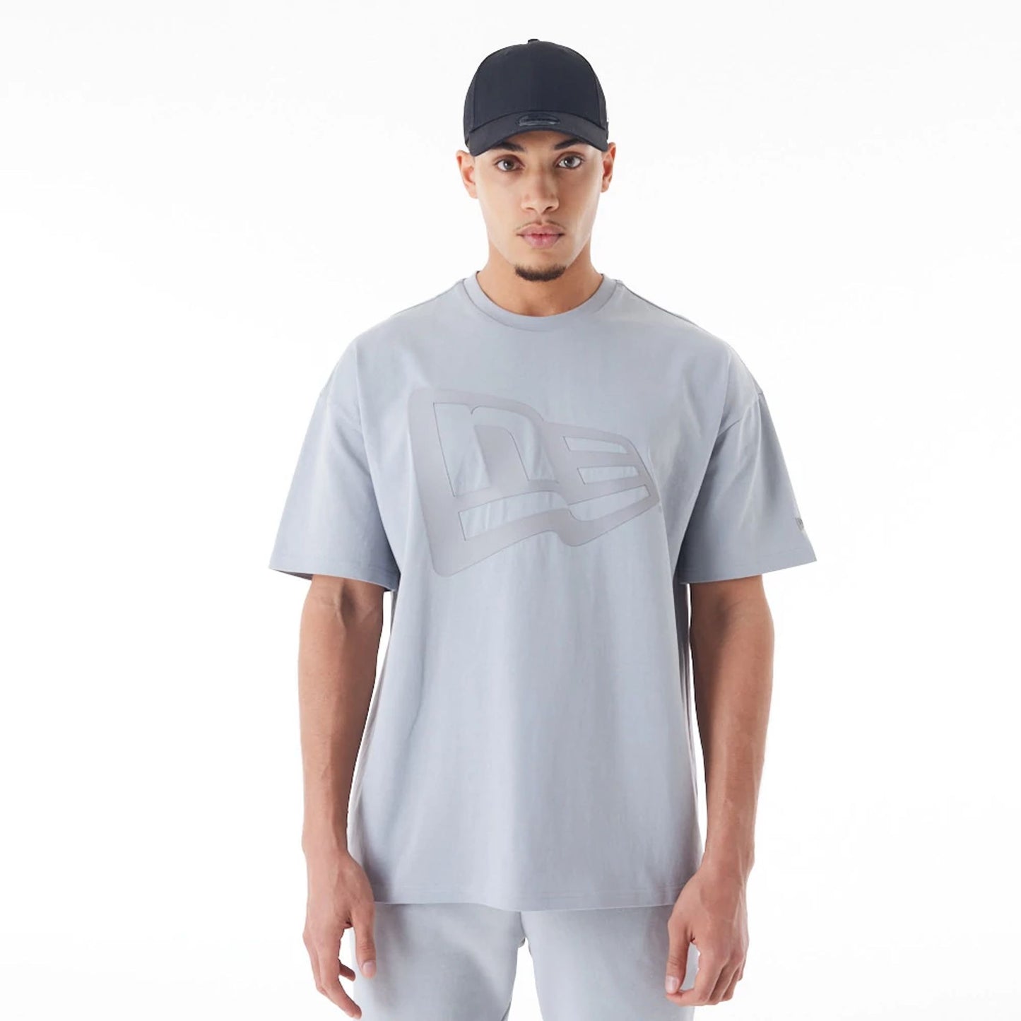 The Male model is wearing  New Era Flag Grey Oversized T-Shirt  1