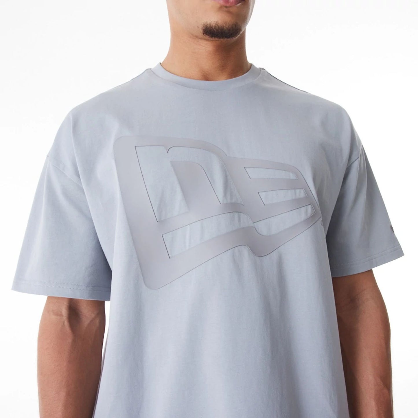 The Male model is wearing  New Era Flag Grey Oversized T-Shirt  4