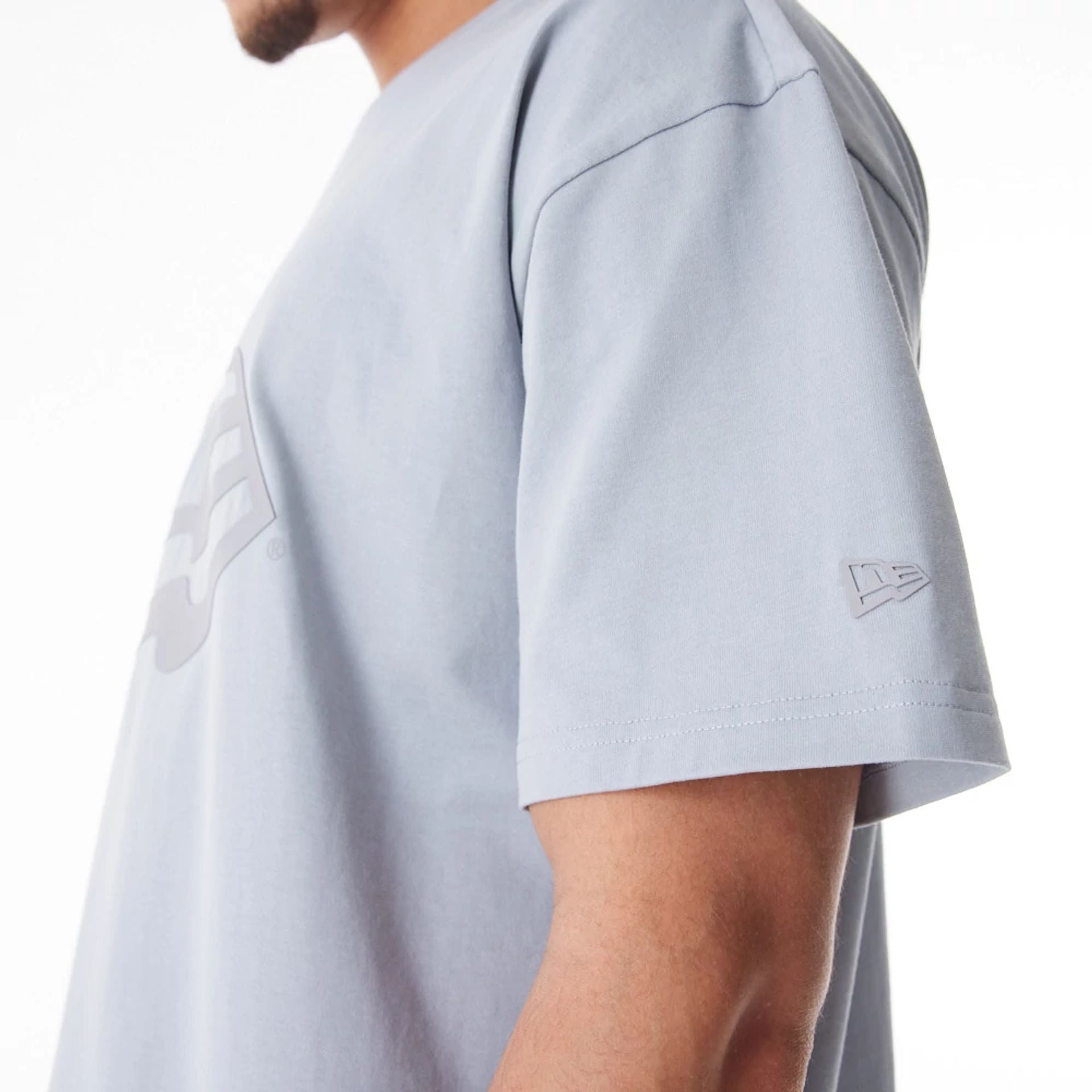 The Male model is wearing  New Era Flag Grey Oversized T-Shirt  5