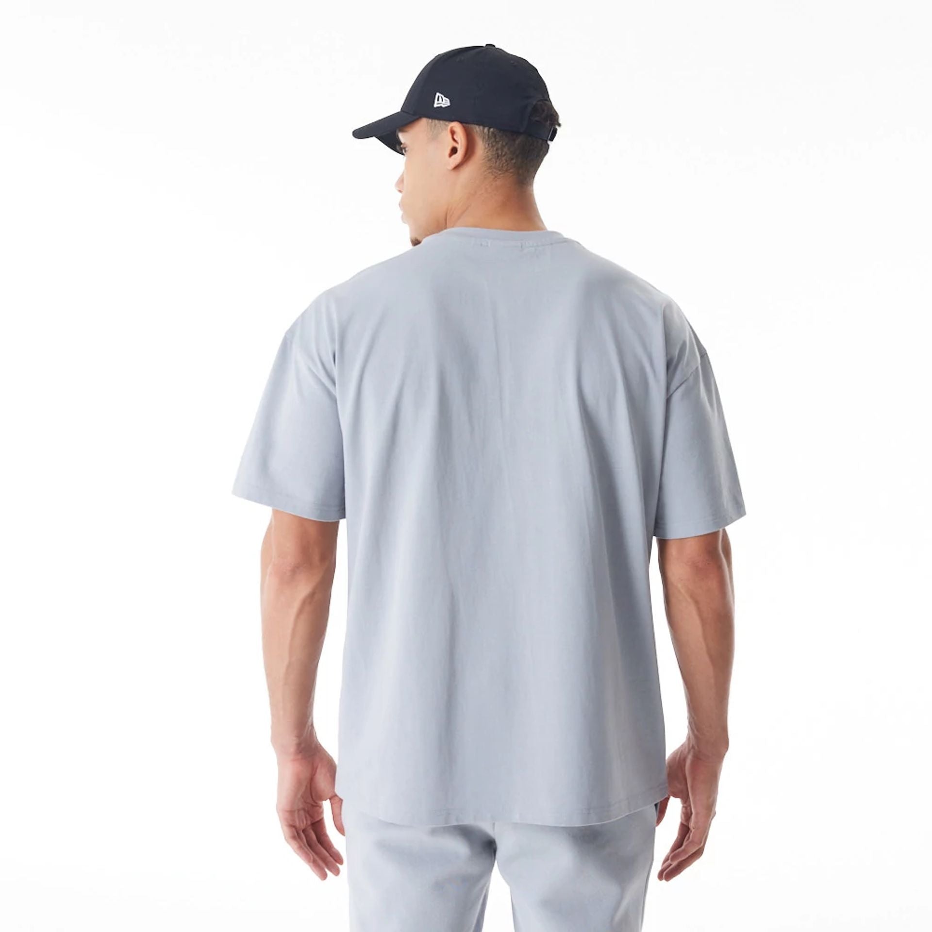 The Male model is wearing  New Era Flag Grey Oversized T-Shirt  2