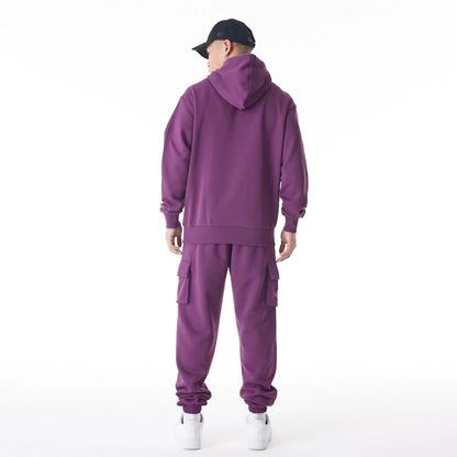 The Male model is wearing  New Era Script Logo Dark Purple Oversized Pullover Hoodie  7