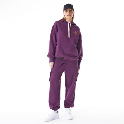 The Male model is wearing  New Era Script Logo Dark Purple Oversized Pullover Hoodie  4