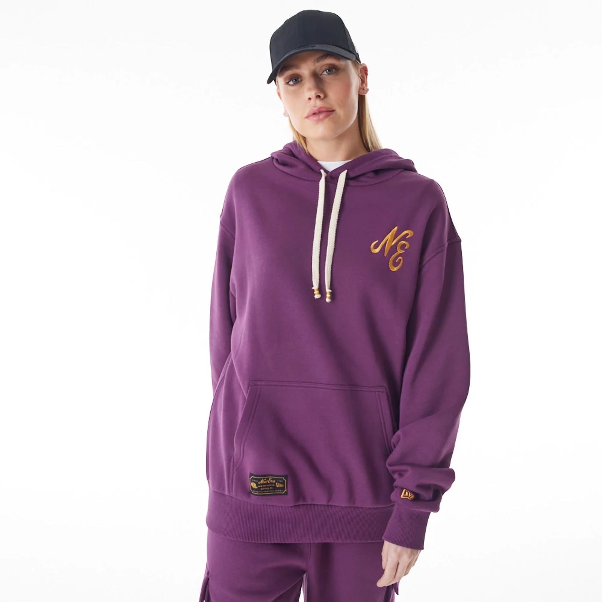 The Male model is wearing  New Era Script Logo Dark Purple Oversized Pullover Hoodie  3