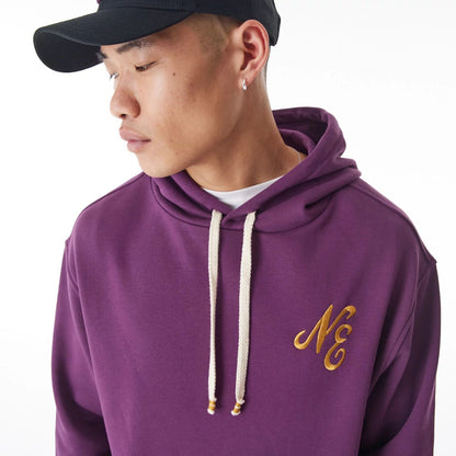 The Male model is wearing  New Era Script Logo Dark Purple Oversized Pullover Hoodie  12