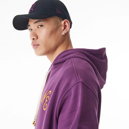 The Male model is wearing  New Era Script Logo Dark Purple Oversized Pullover Hoodie  8