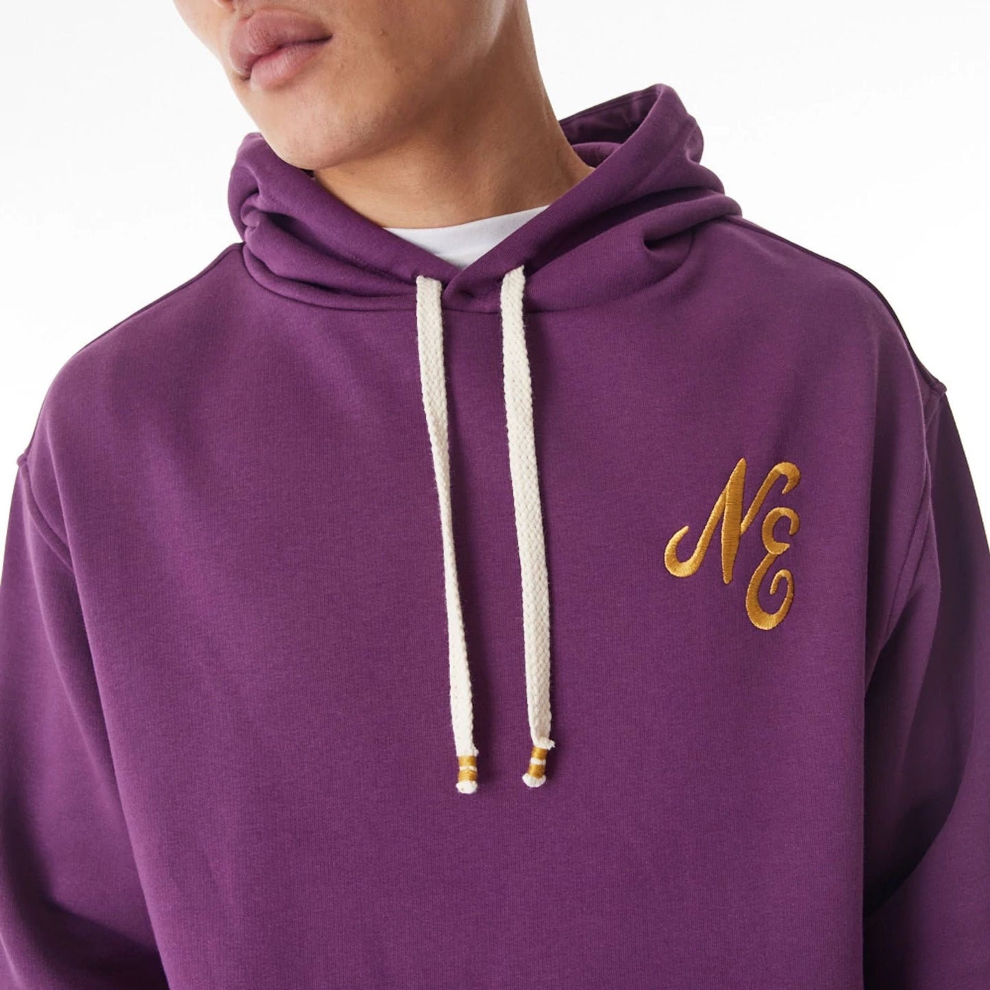 The Male model is wearing  New Era Script Logo Dark Purple Oversized Pullover Hoodie  9