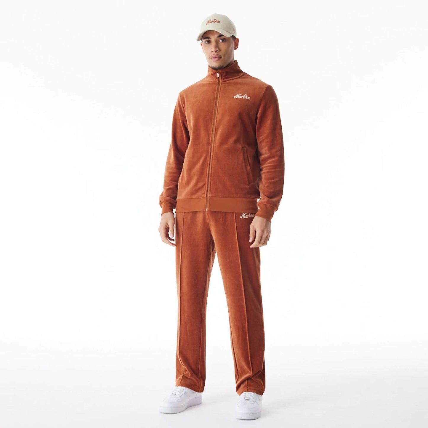 The Male model is wearing  New Era Velour Brown Track Jacket  6