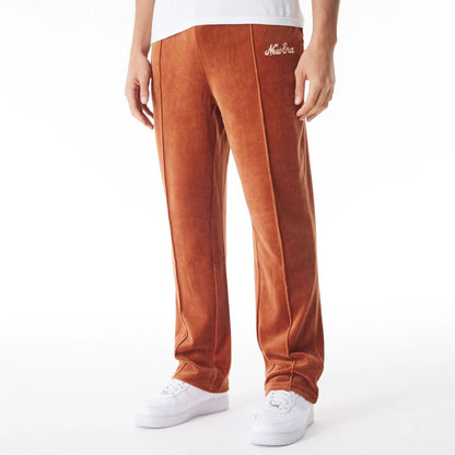 The Male model is wearing  New Era Velour Brown Track Joggers  1