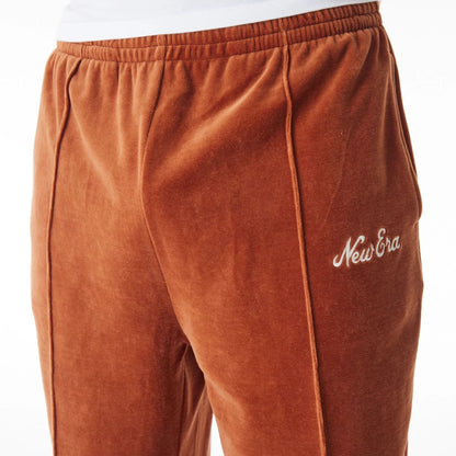 The Male model is wearing  New Era Velour Brown Track Joggers  3