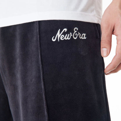 The Male model is wearing  New Era Velour Black Track Joggers  8