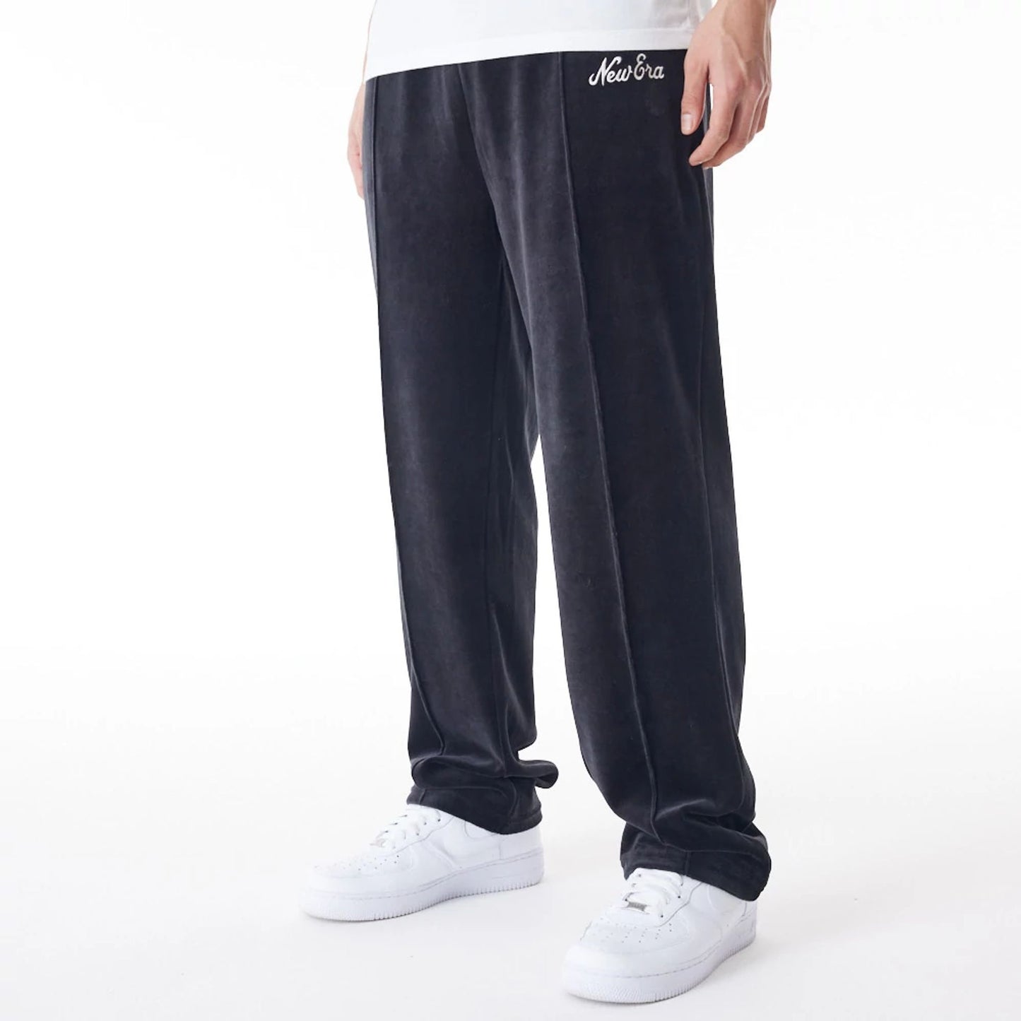 The Male model is wearing  New Era Velour Black Track Joggers  1