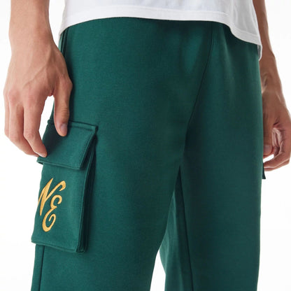 The Male model is wearing  New Era Script Cargo Dark Green Joggers  8