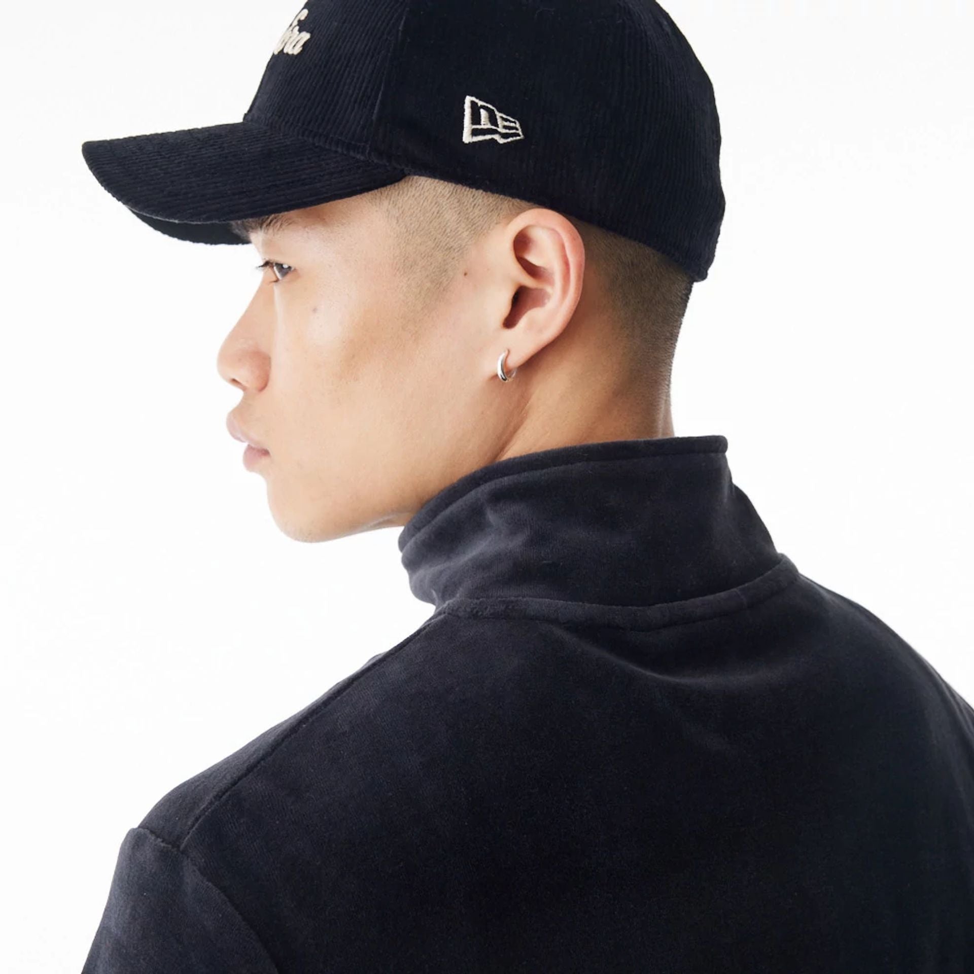 The Male model is wearing  New Era Velour Black Track Jacket  6