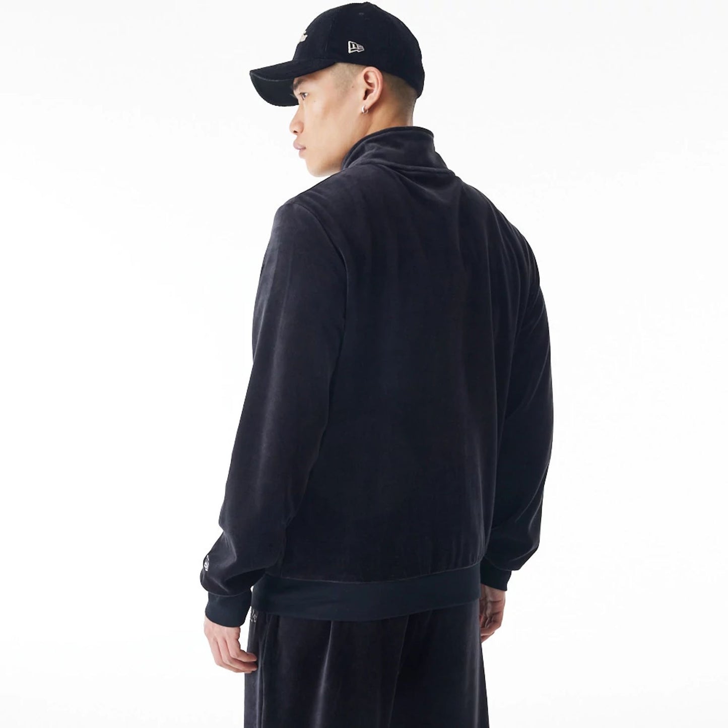 The Male model is wearing  New Era Velour Black Track Jacket  7