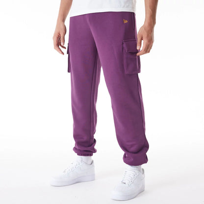 The Male model is wearing  New Era Script Cargo Dark Purple Joggers  2