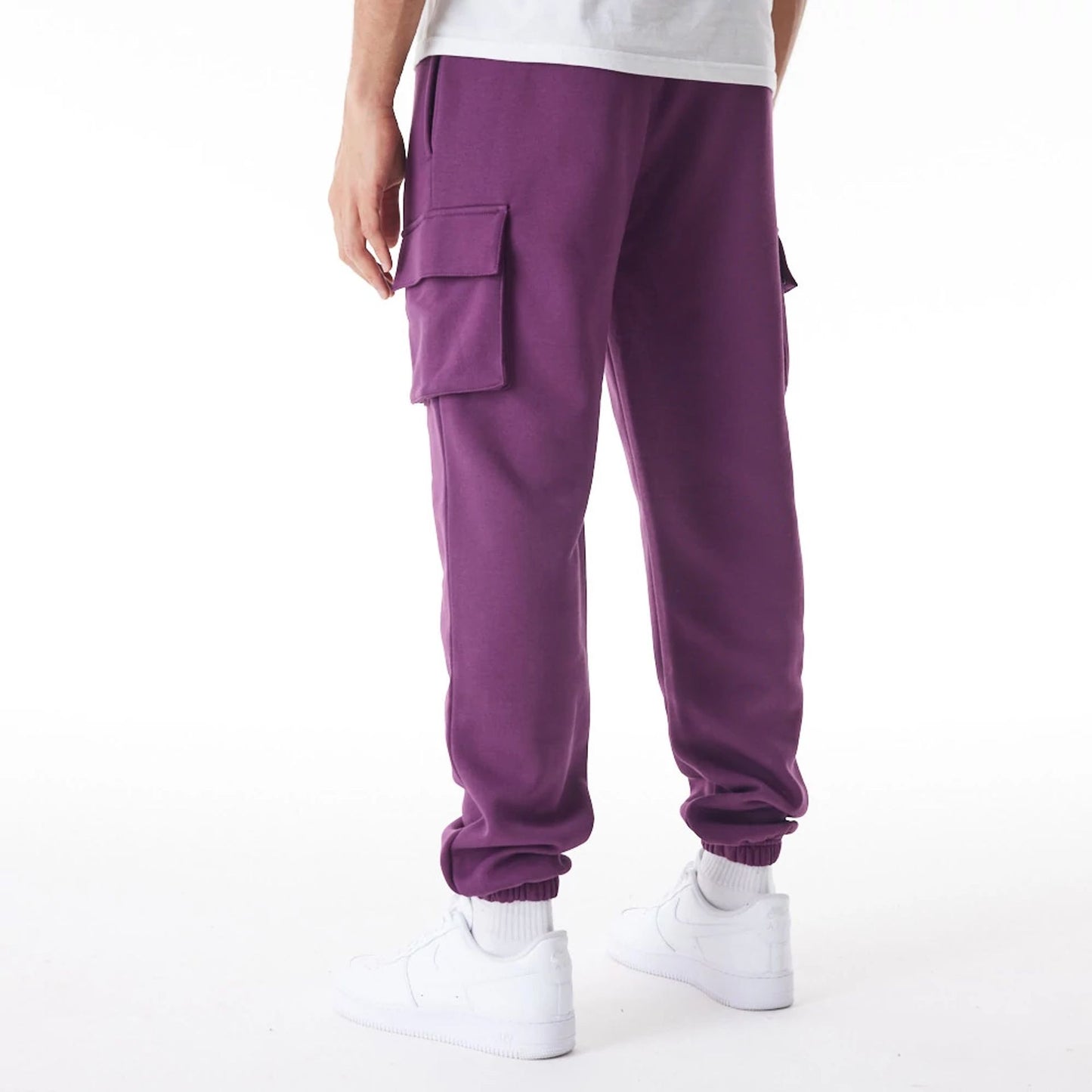 The Male model is wearing  New Era Script Cargo Dark Purple Joggers  3