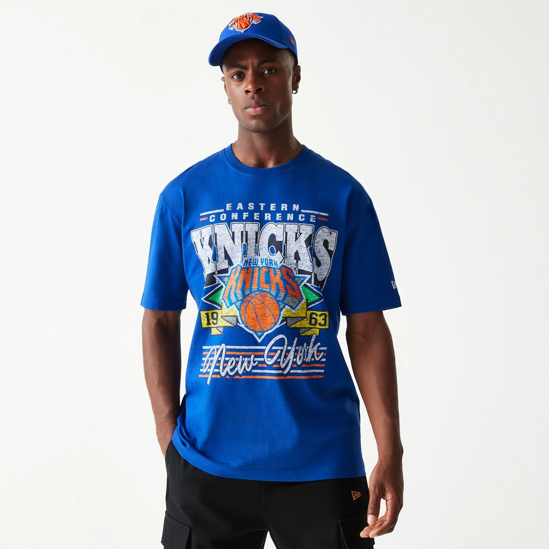 The Male model is wearing New York Knicks Sport Classic Blue T-Shirt 1