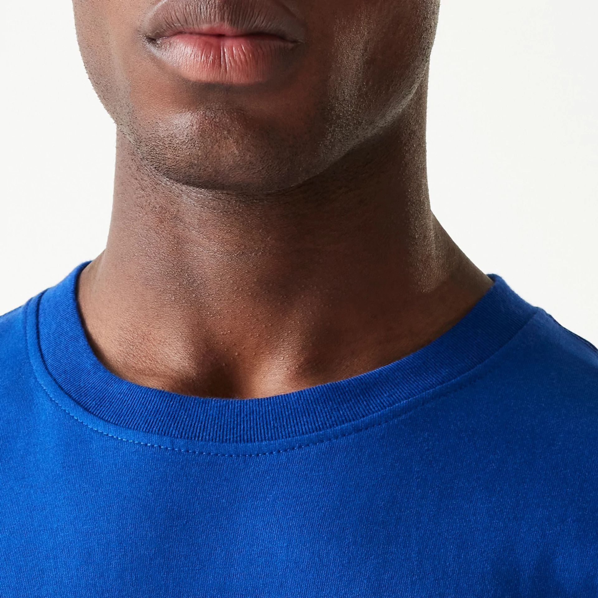 The Male model is wearing New York Knicks Sport Classic Blue T-Shirt 4