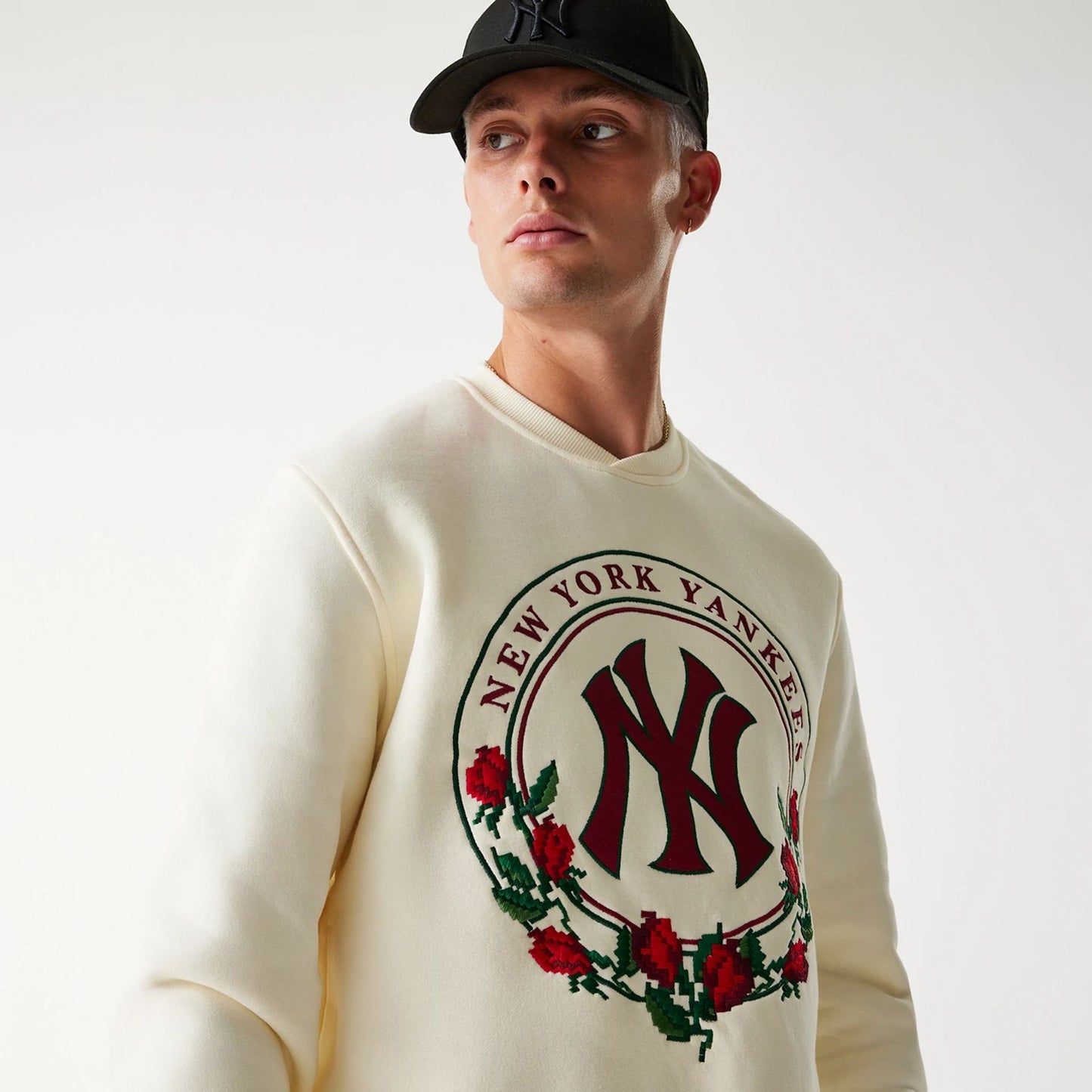 The Male model is wearing New York Yankees Red Roses White Crewneck Sweater 5