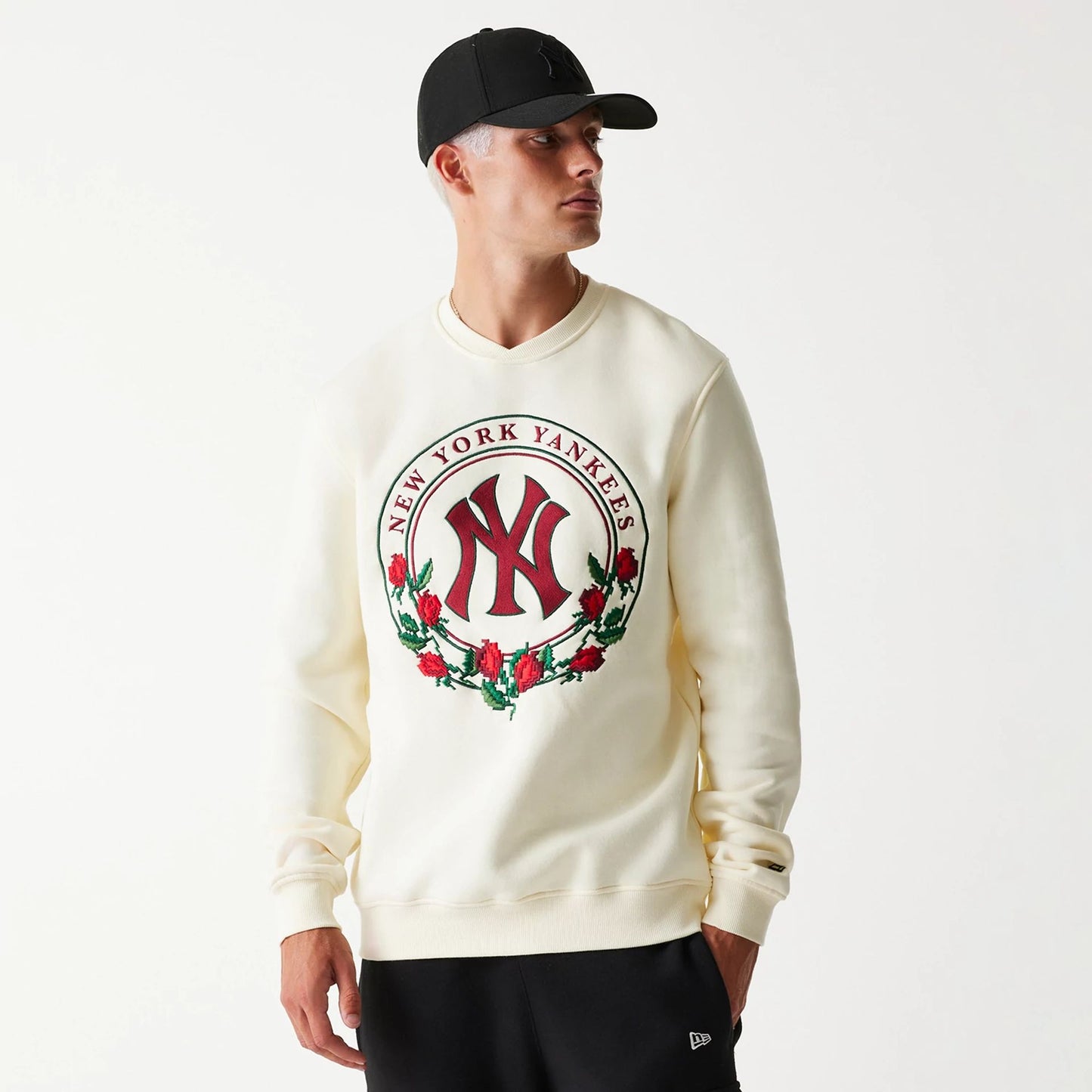 The Male model is wearing New York Yankees Red Roses White Crewneck Sweater 1