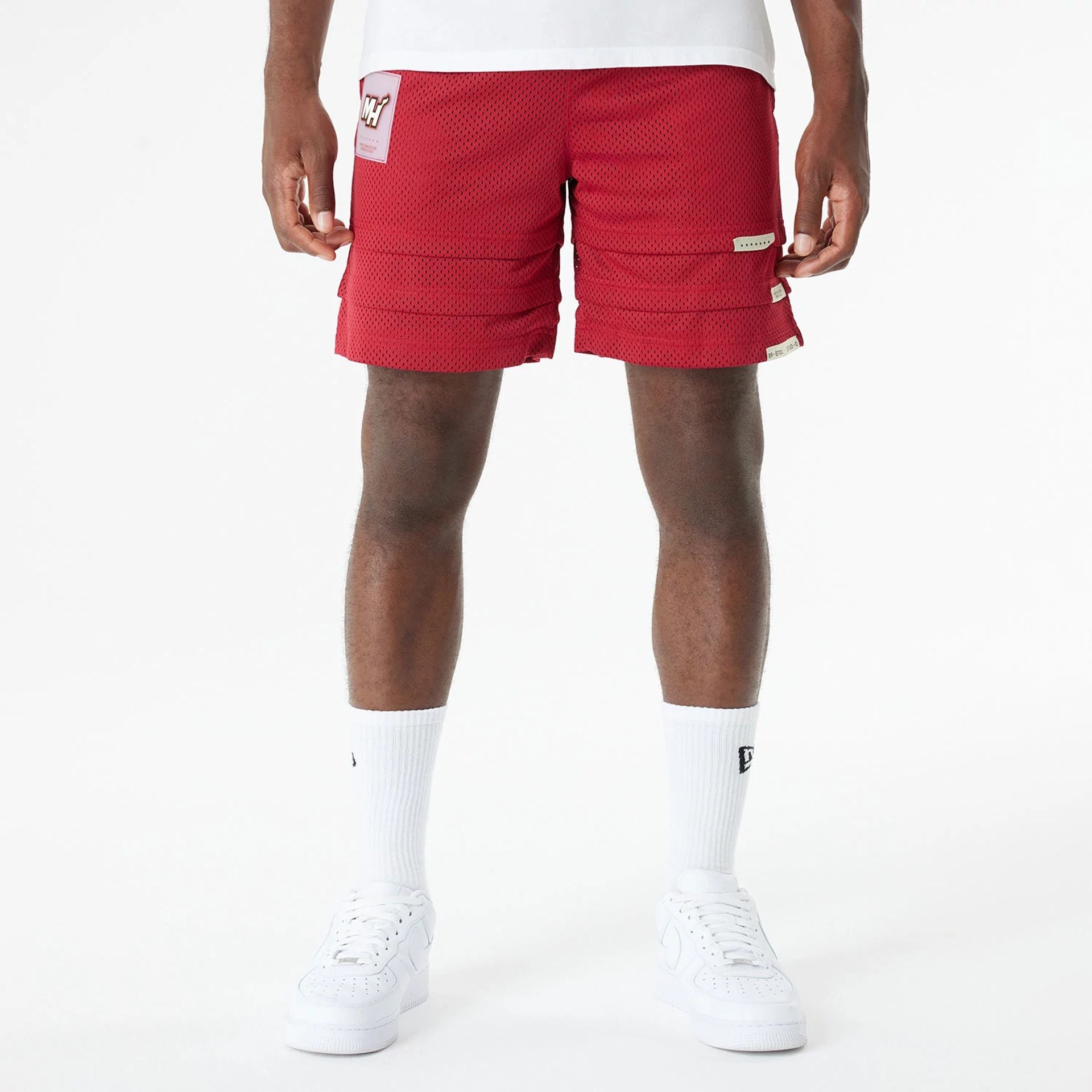 The Male model is wearing Miami Heat Bristol Studio x NBA Dark Red Shorts 1