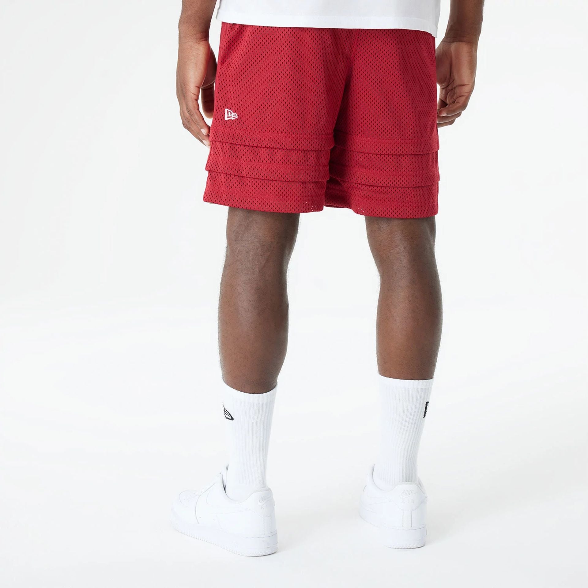 The Male model is wearing Miami Heat Bristol Studio x NBA Dark Red Shorts 2