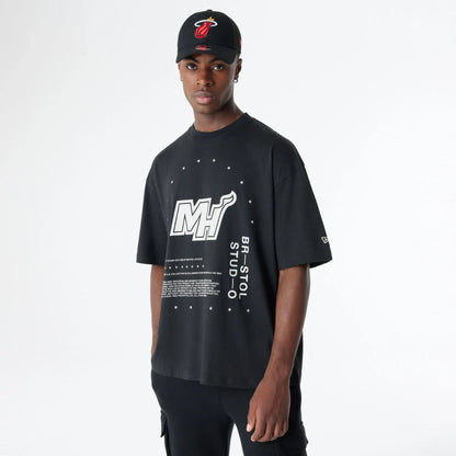 The Male model is wearing Miami Heat Bristol Studio x NBA Black Oversized T-Shirt 6