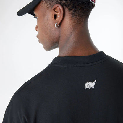 The Male model is wearing Miami Heat Bristol Studio x NBA Black Oversized T-Shirt 7