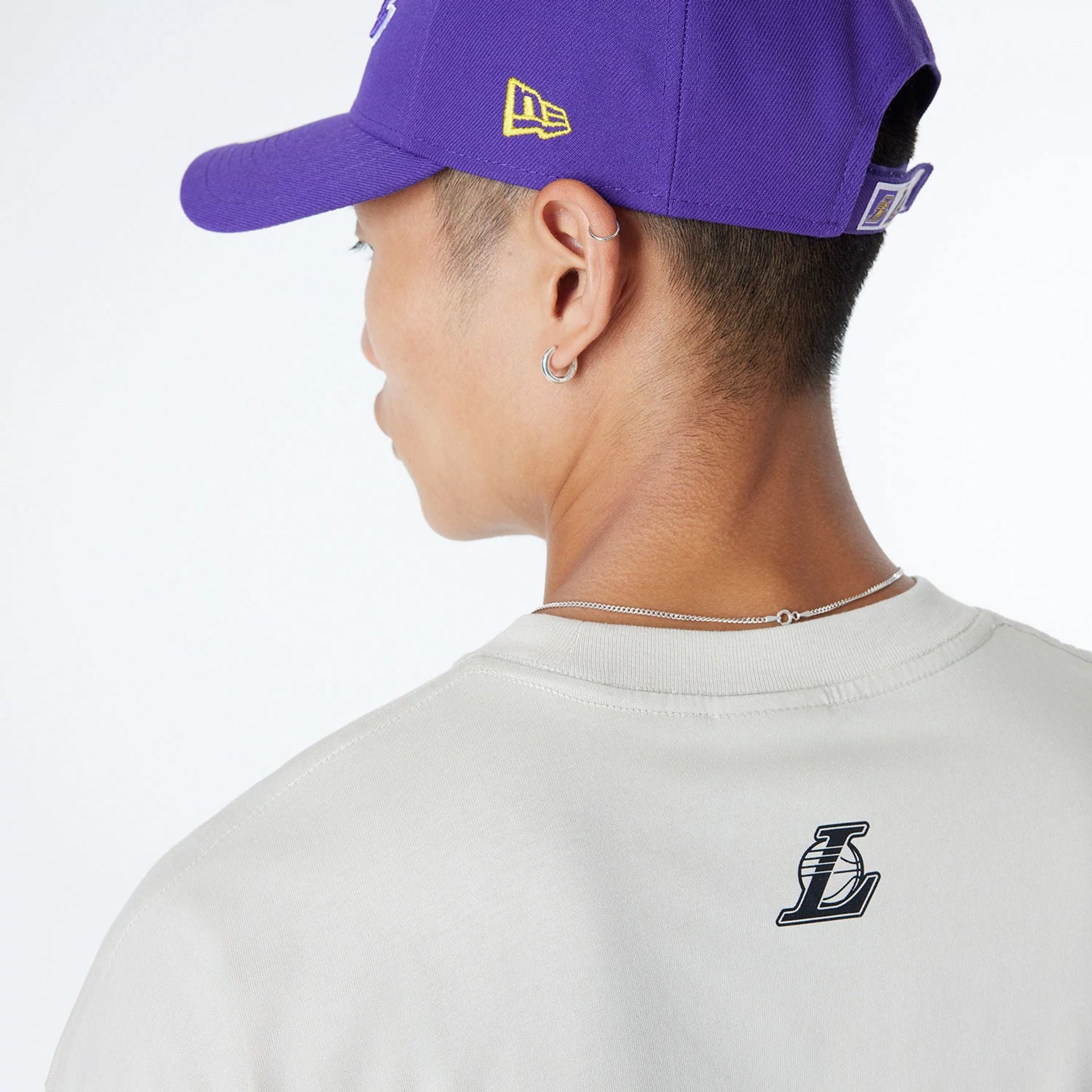 The Male model is wearing LA Lakers Bristol Studio x NBA Light Beige Oversized T-Shirt 7