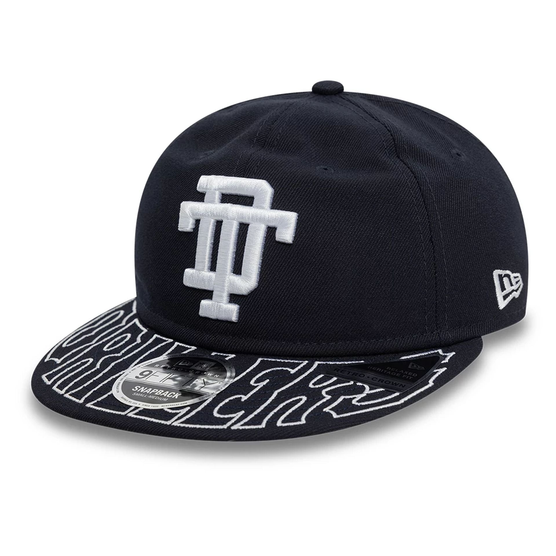 This is a Tulsa Drillers MiLB Visor Script Navy Retro Crown 9FIFTY Strapback Cap 1