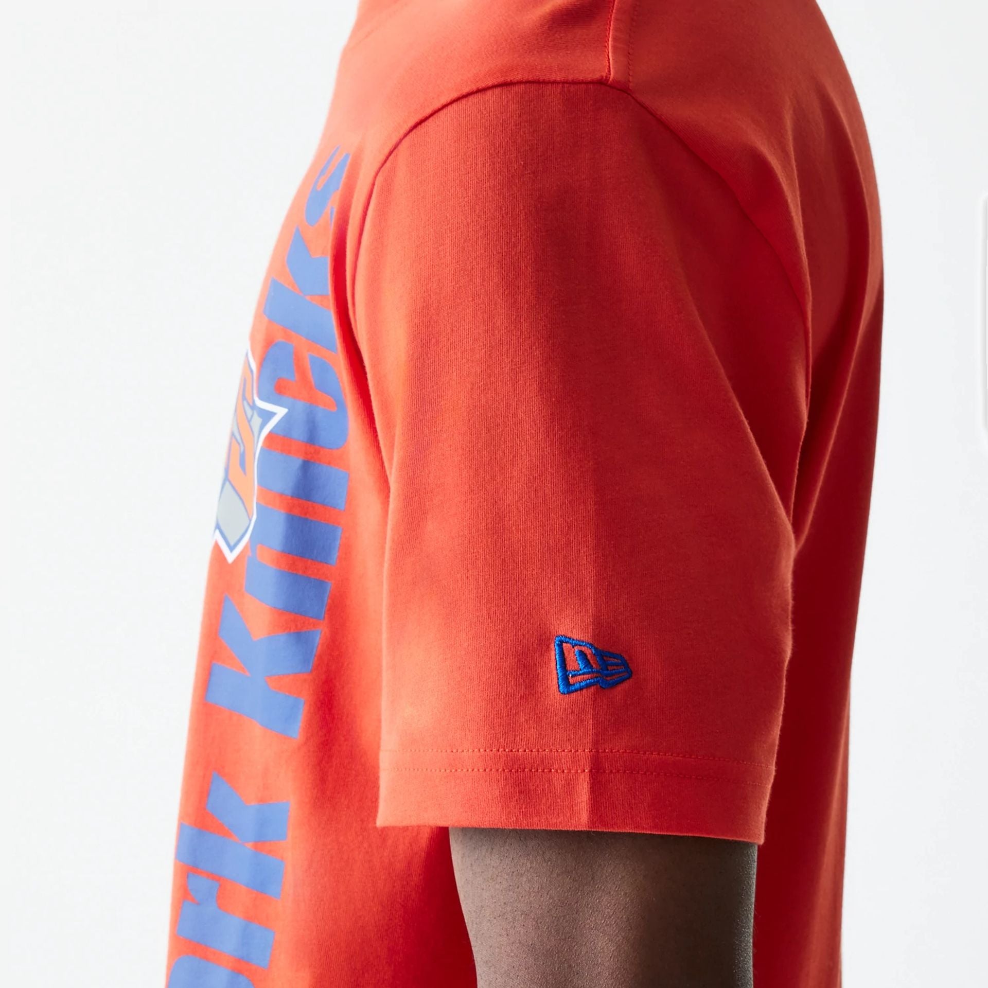 The Male model is wearing New York Knicks NBA City Edition Orange T-Shirt 5