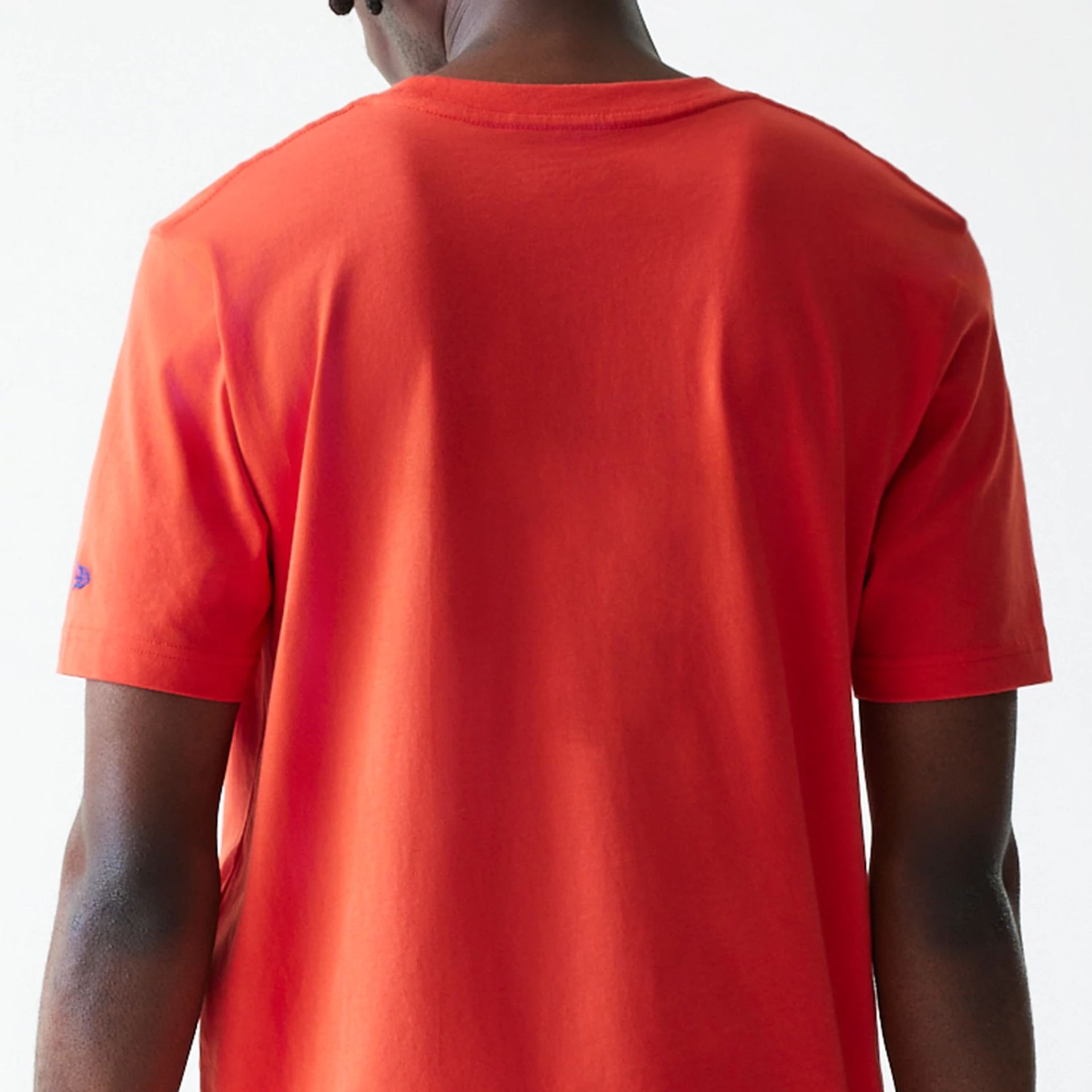 The Male model is wearing New York Knicks NBA City Edition Orange T-Shirt 7