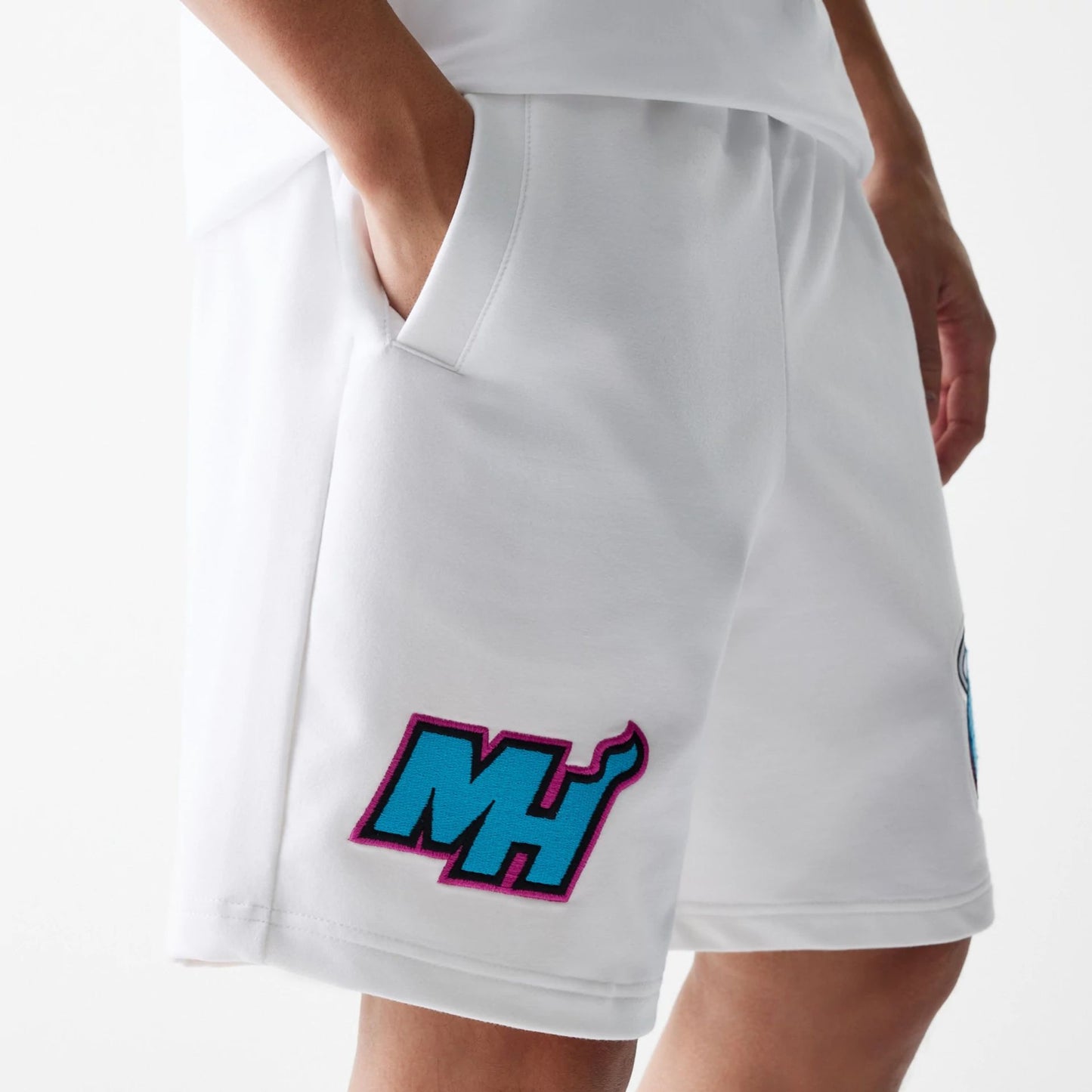 The Male model is wearing Miami Heat NBA City Edition Grey Shorts 5