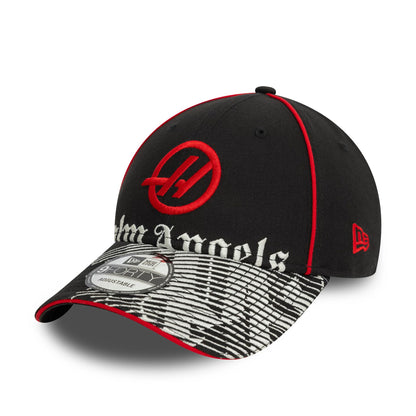 This is a Palm Angels x MoneyGram Haas F1 Team x New Era Black 9FORTY Adjustable Cap 1