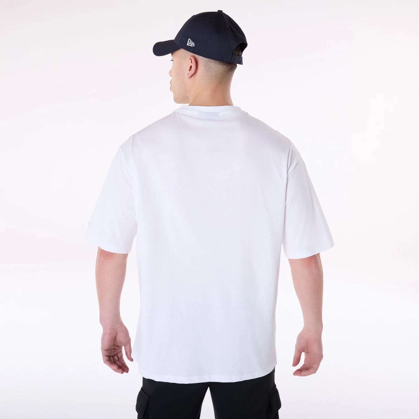 The Male model is wearing New Era 1920 Racing Championship White T-Shirt 4