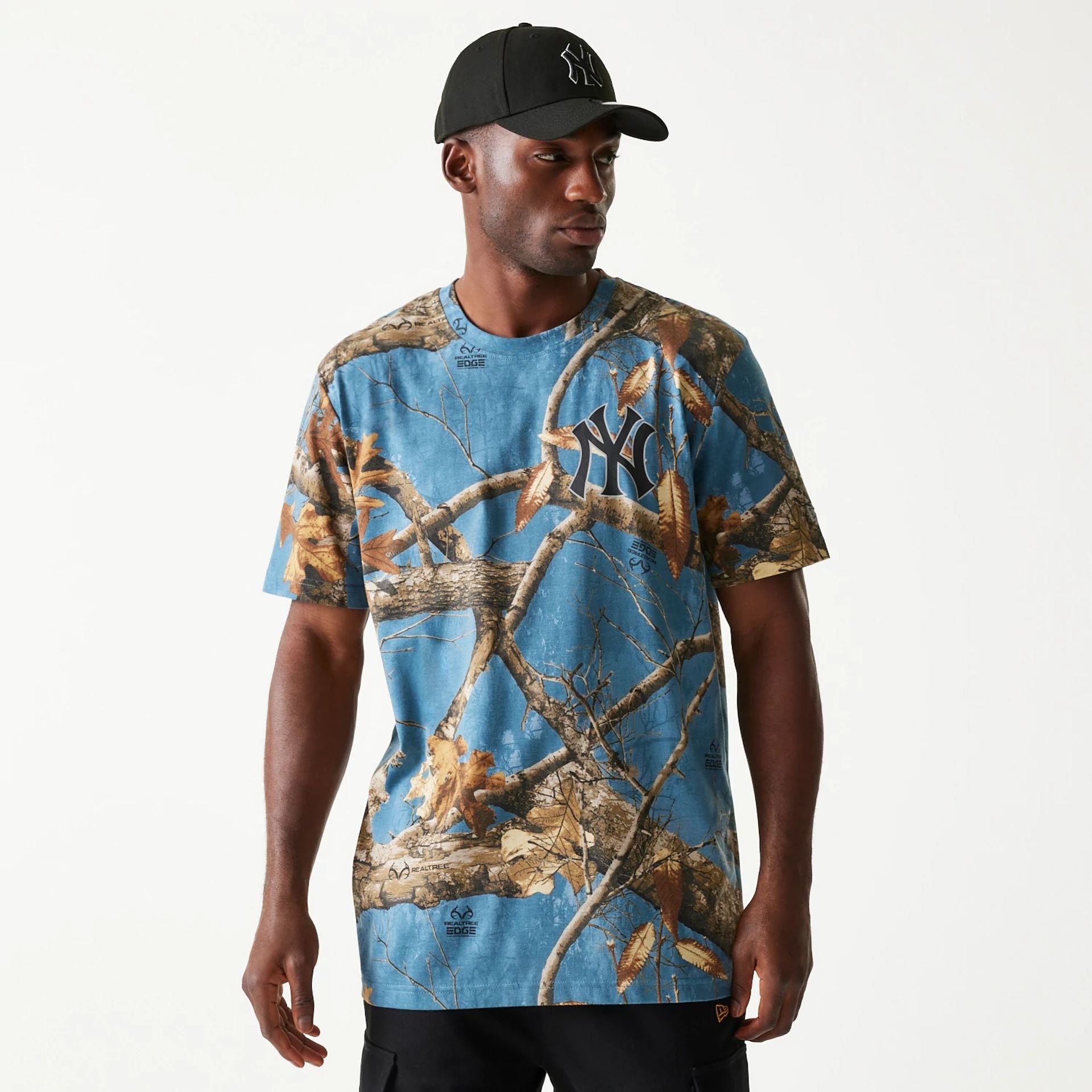 The Male model is wearing New York Yankees Realtree Edge Slate Blue T-Shirt 1