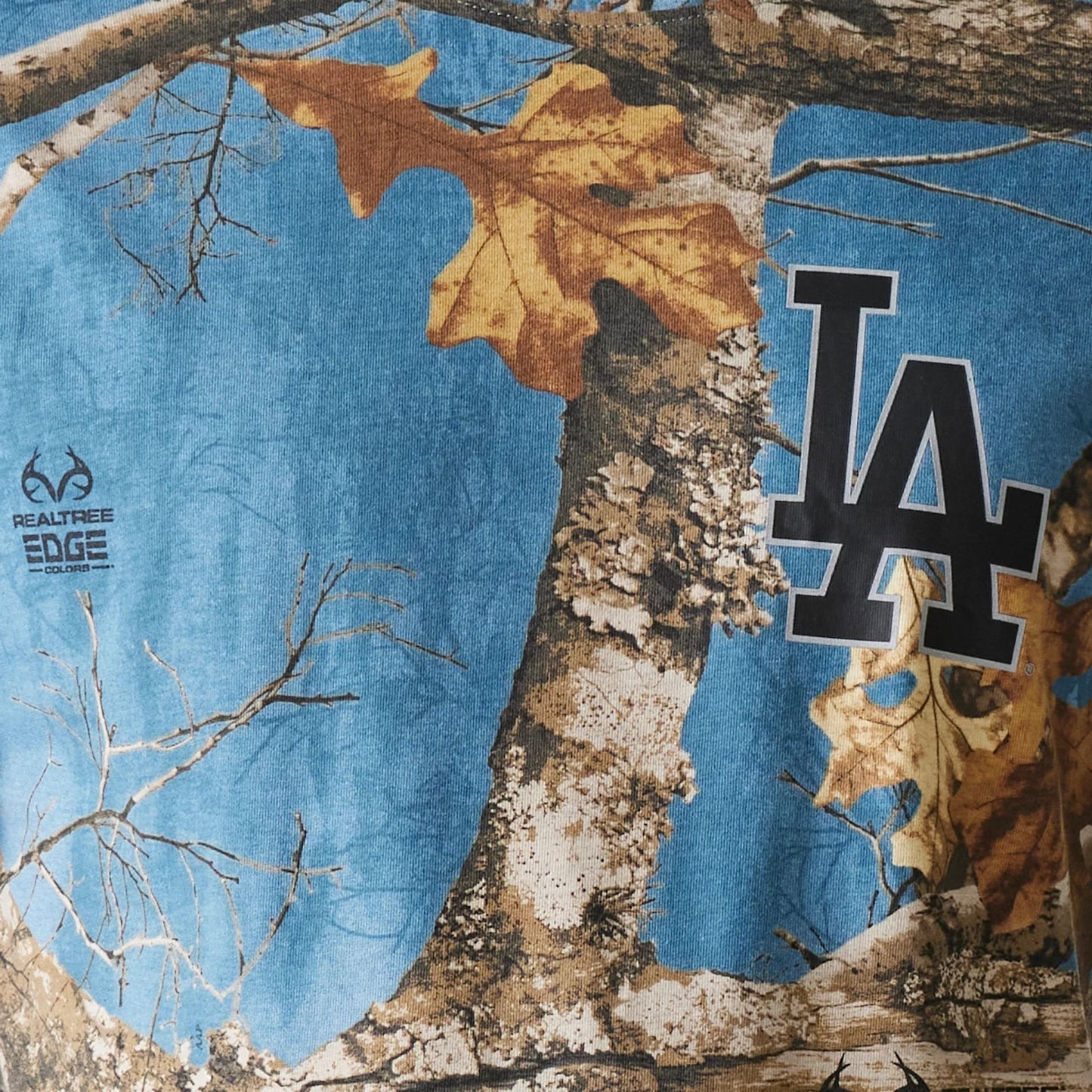 The Male model is wearing LA Dodgers Realtree Edge Slate Blue T-Shirt 4