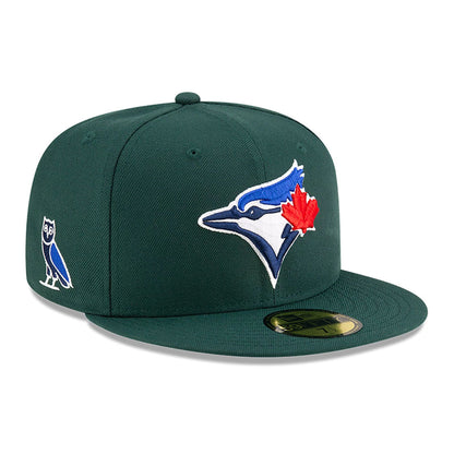 This is a Toronto Blue Jays OVO x MLB 2024 Dark Green 59FIFTY Fitted Cap 1